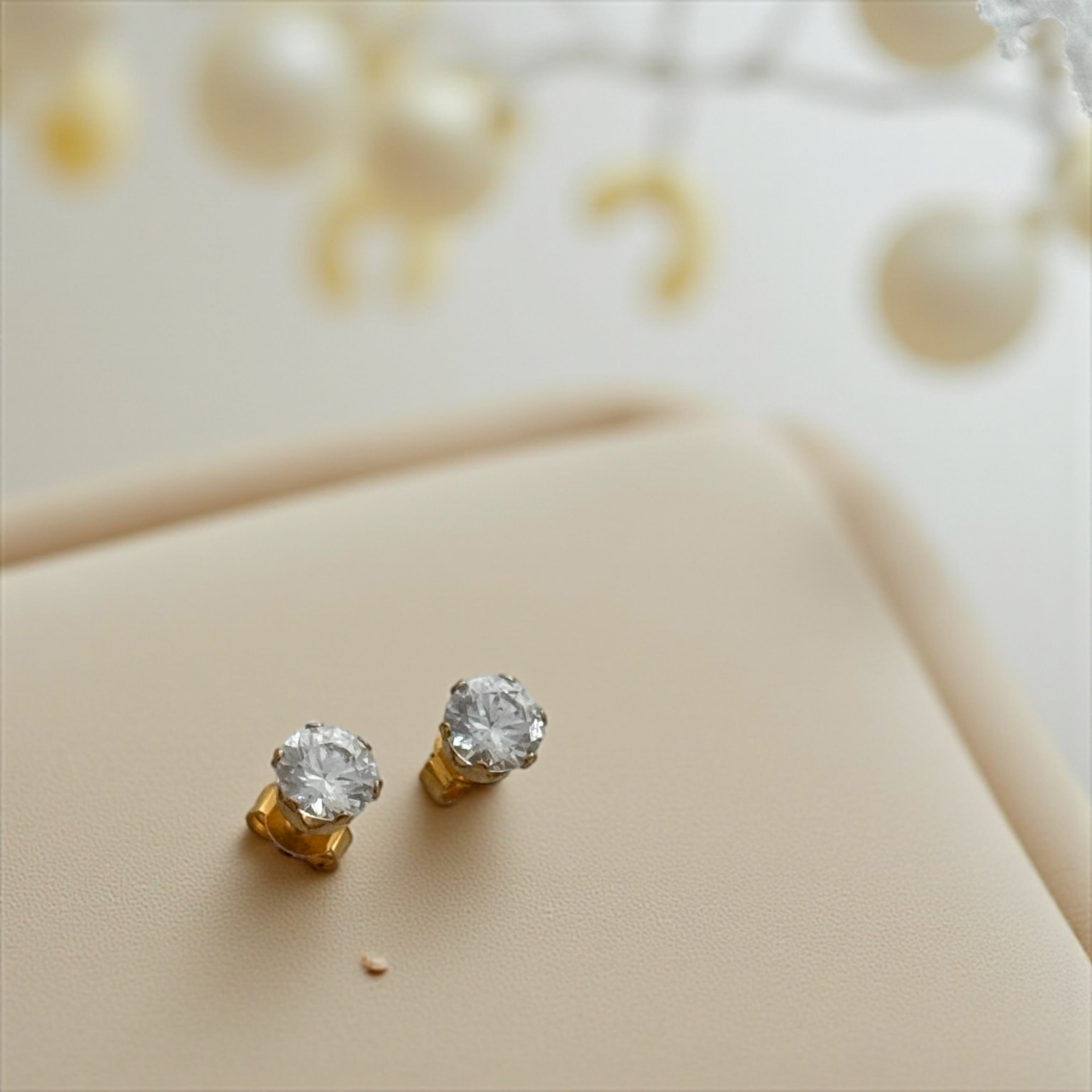 pair of solid yellow gold pear-cut cubic zirconia stud earrings with push backs