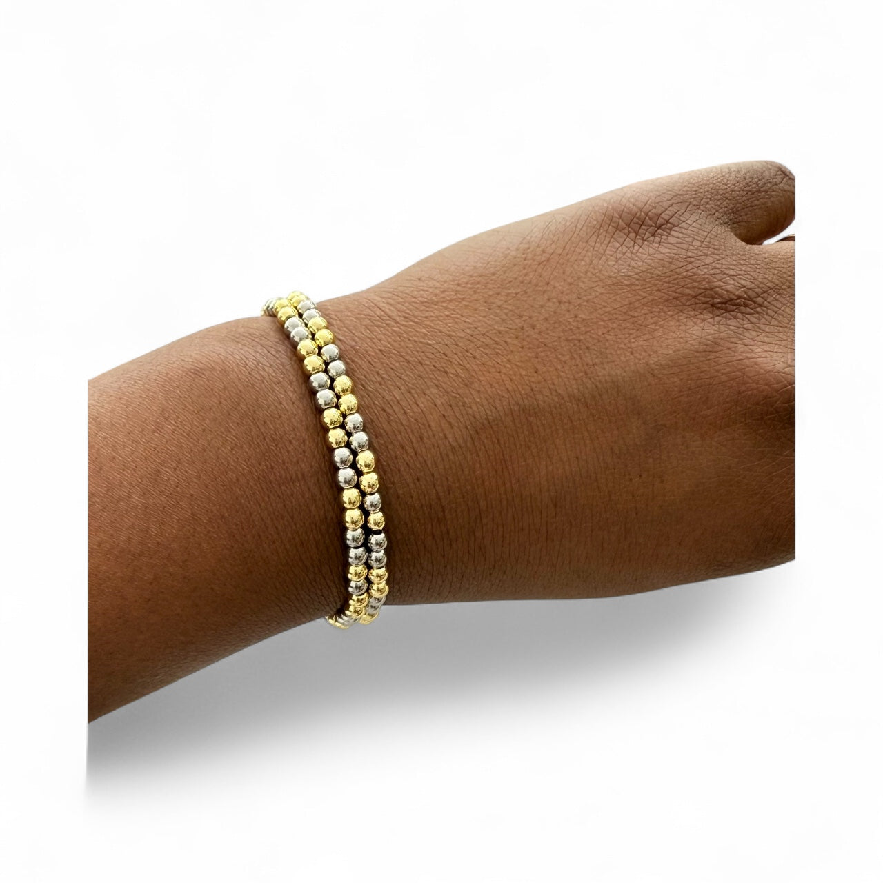 Two-tone beaded bracelet made with gold and silver-colored beads.