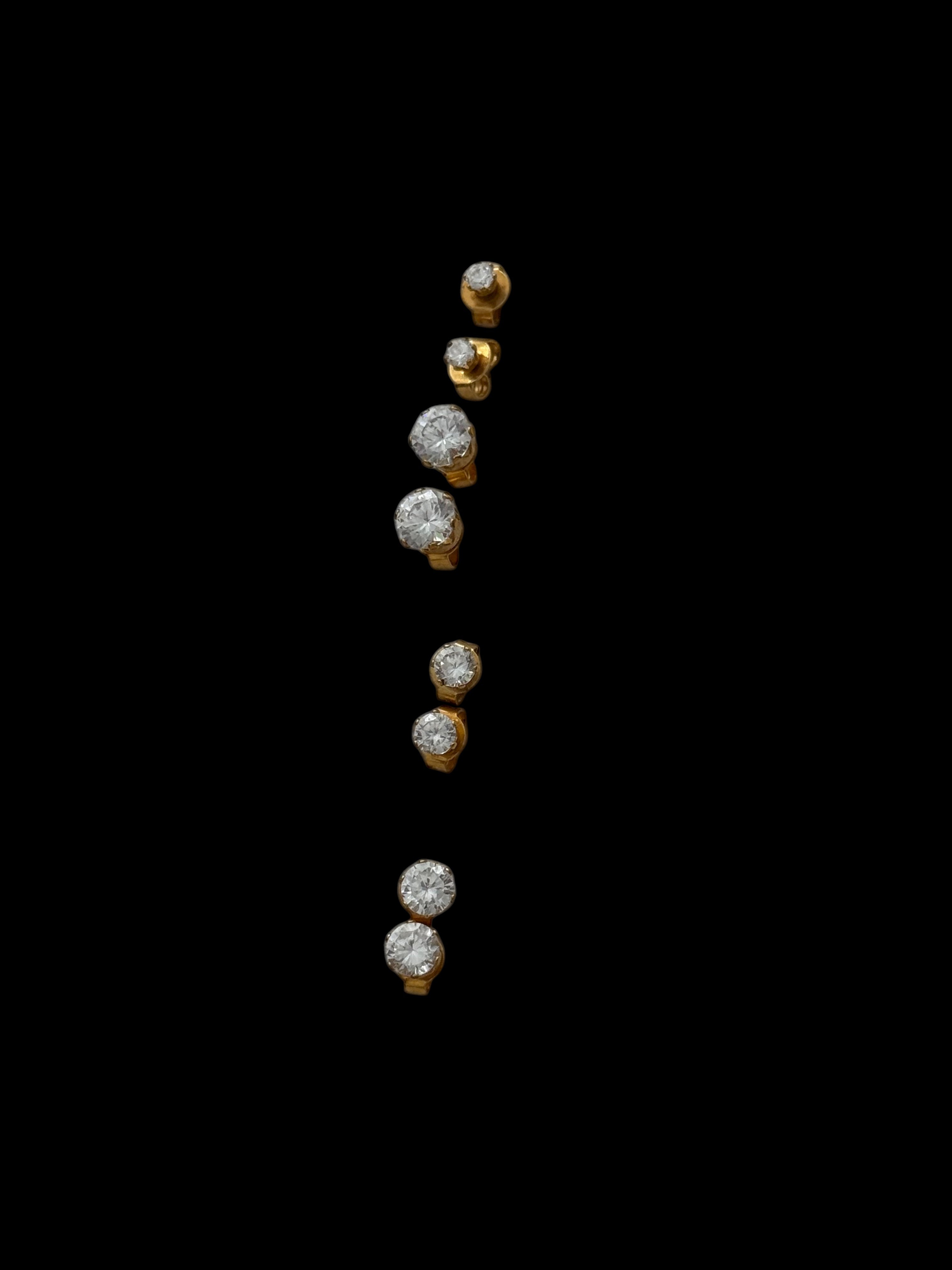 Four pair of yellow gold five-stone diamond climber earrings.